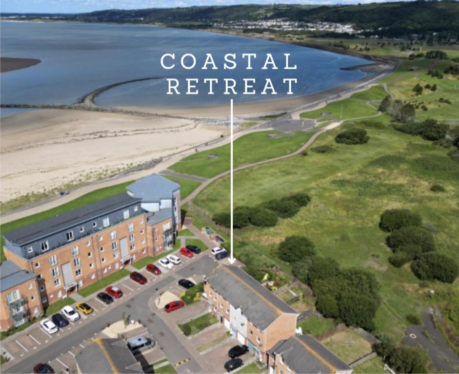 a rendering of a coastal retreat with the words coastal retreat at Coastal Retreat in Carmarthenshire in Llanelli