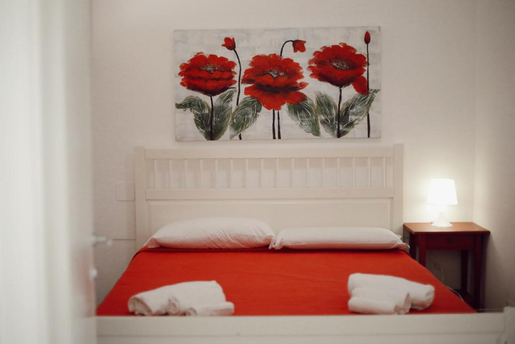 A bed or beds in a room at BlueBay Residence Resort