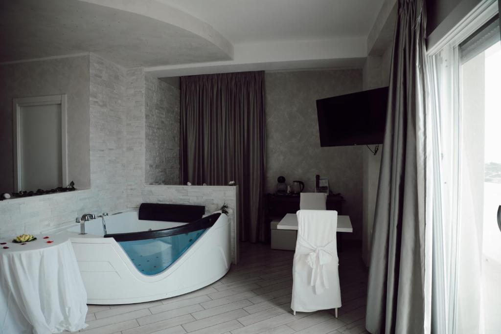 A television and/or entertainment centre at BlueBay Residence Resort