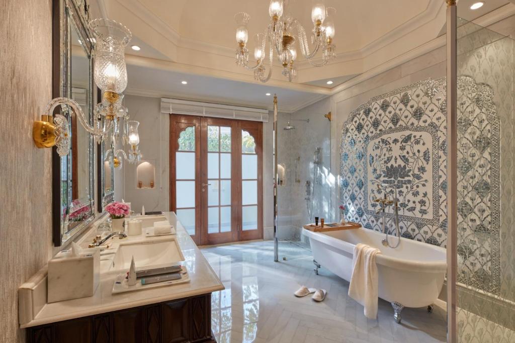 a bathroom with a tub and a sink and a mirror at Mementos by ITC Hotels Jaipur in Jaipur