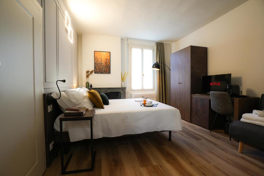 Postel nebo postele na pokoji v ubytování Mazzini's Rooms