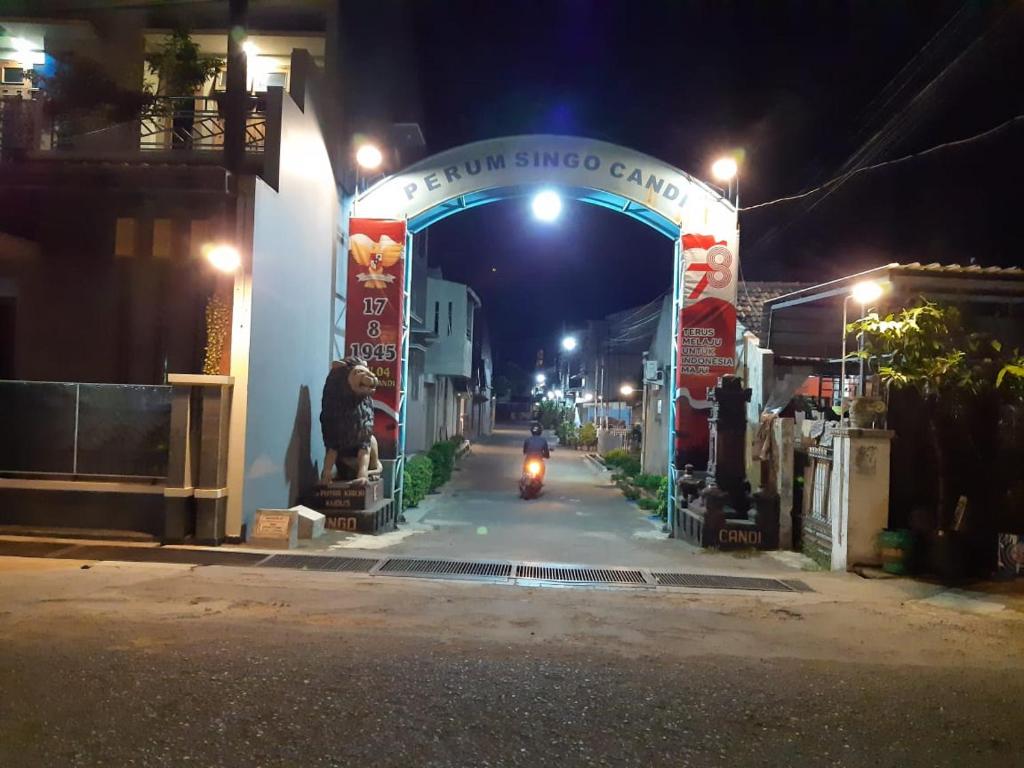 a motorcycle driving through a tunnel at night at Homestay Cendana Candi 1 Kudus in Kudus