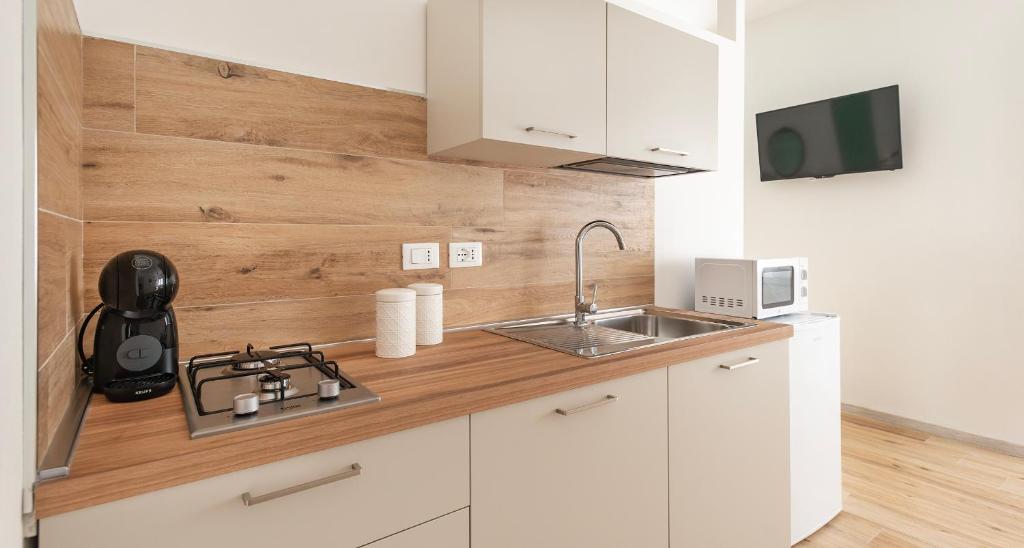 Kuchyň nebo kuchyňský kout v ubytování Ombra i Sol apartments