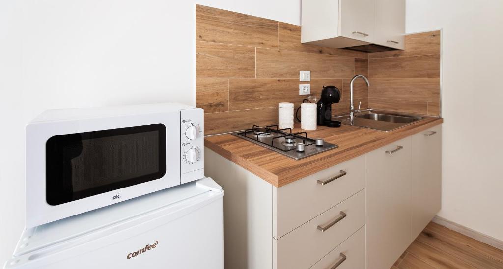 Kuchyň nebo kuchyňský kout v ubytování Ombra i Sol apartments