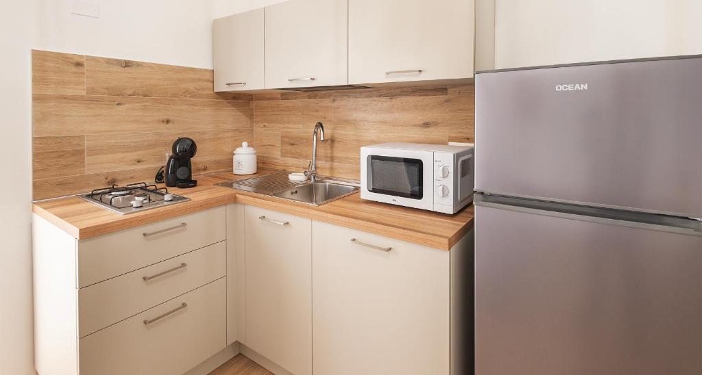 Kuchyň nebo kuchyňský kout v ubytování Ombra i Sol apartments