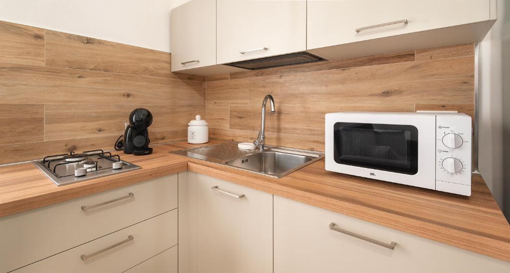 Kuchyň nebo kuchyňský kout v ubytování Ombra i Sol apartments