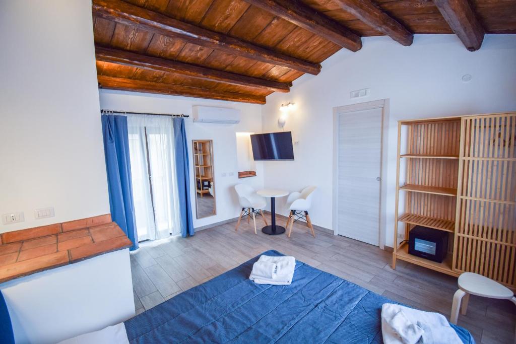 Postel nebo postele na pokoji v ubytování Ruggero Suite