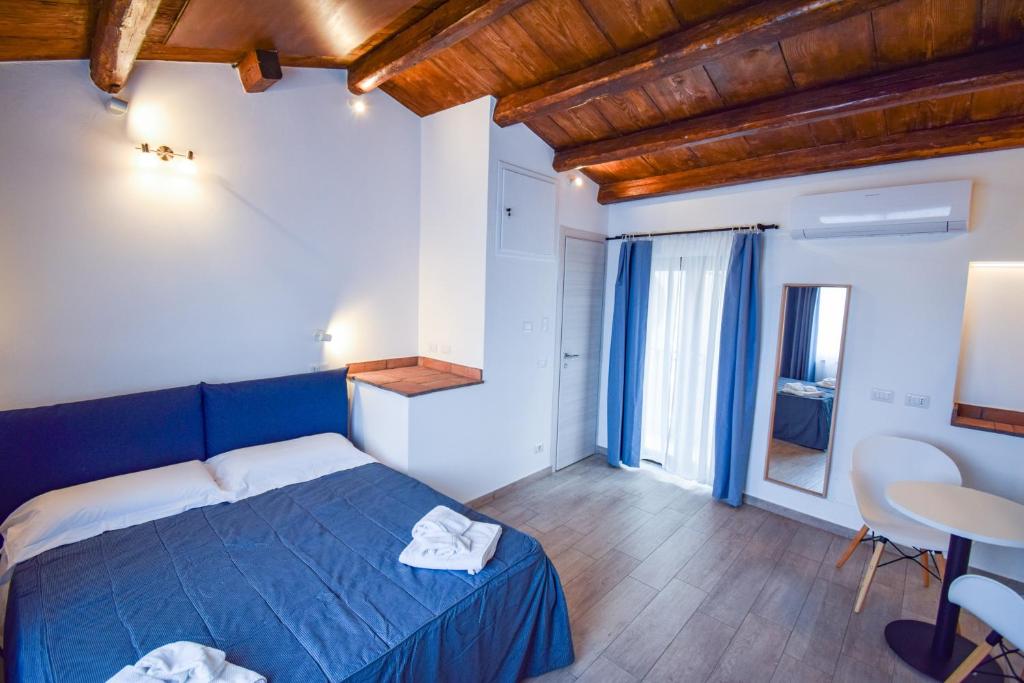 Postel nebo postele na pokoji v ubytování Ruggero Suite