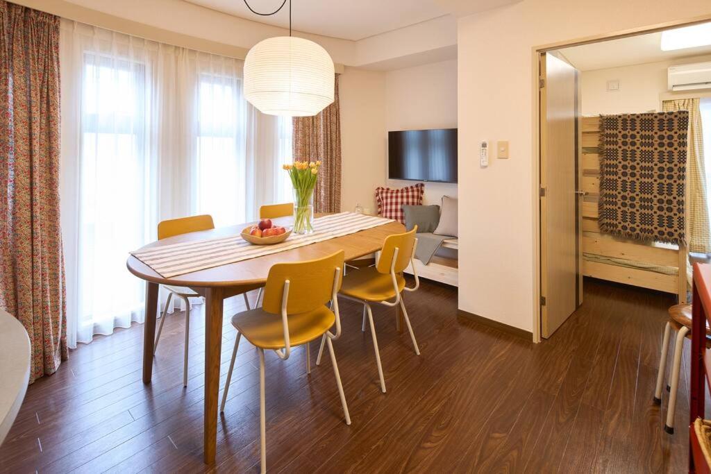a dining room with a table and chairs at Liberty house208 /Shibuya 5min by train Sangenjaya in Tokyo