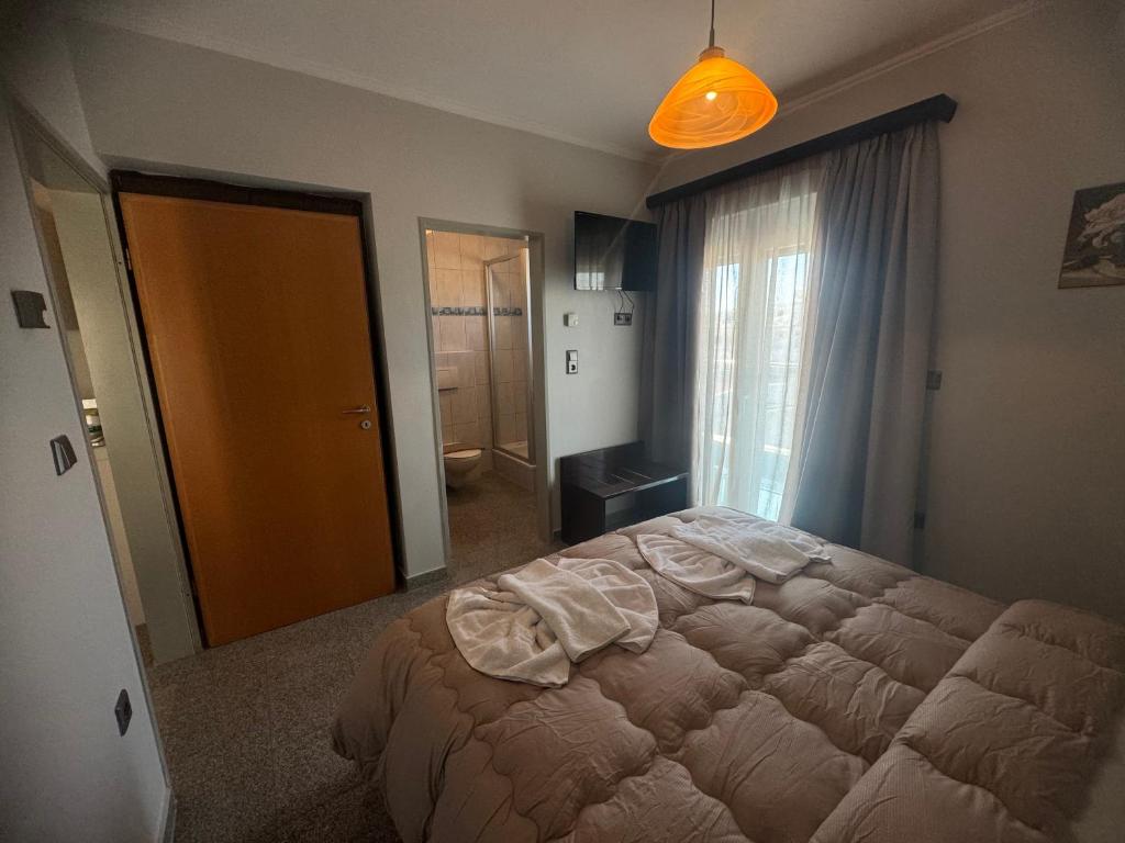 Postel nebo postele na pokoji v ubytování Comfort Hotel Apartments