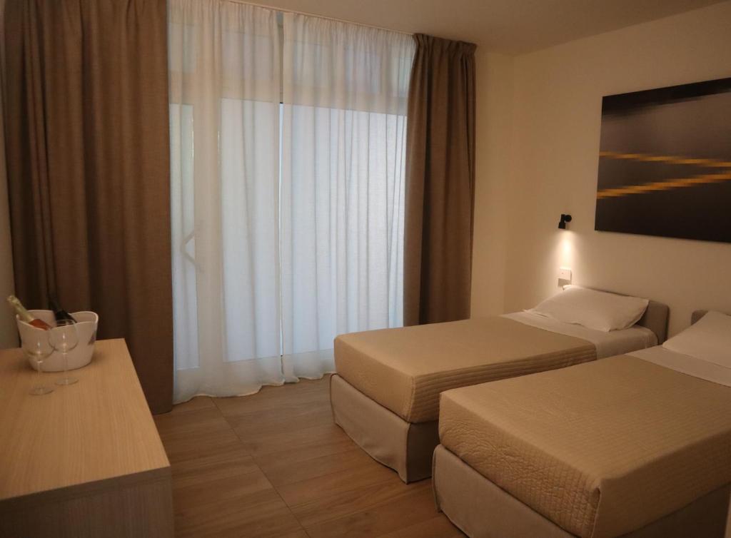 Postel nebo postele na pokoji v ubytování Residence Perlago