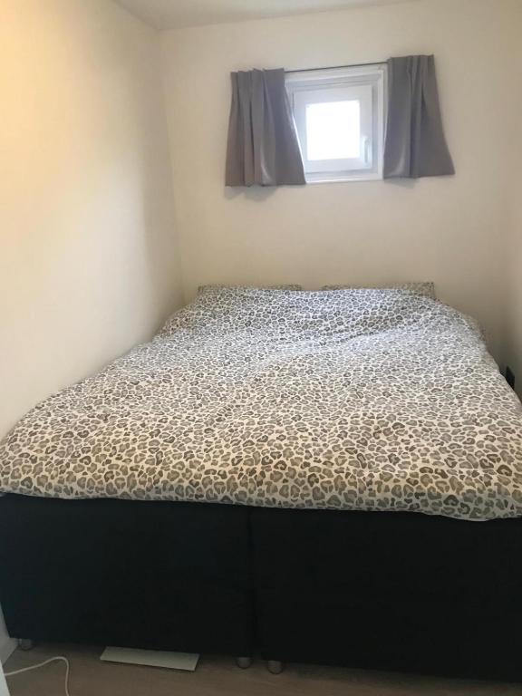 Postel nebo postele na pokoji v ubytování Uniek overnachten in een Tiny House op de Appelhof