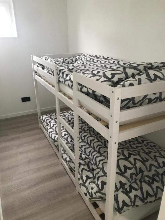 Postel nebo postele na pokoji v ubytování Uniek overnachten in een Tiny House op de Appelhof