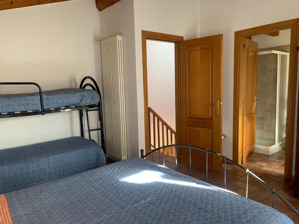 Postel nebo postele na pokoji v ubytování Agriturismo Case in Collina