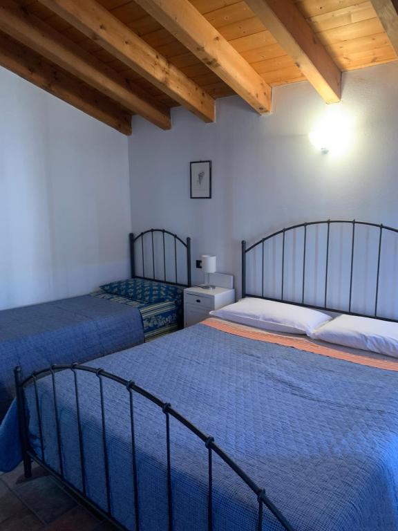 Postel nebo postele na pokoji v ubytování Agriturismo Case in Collina