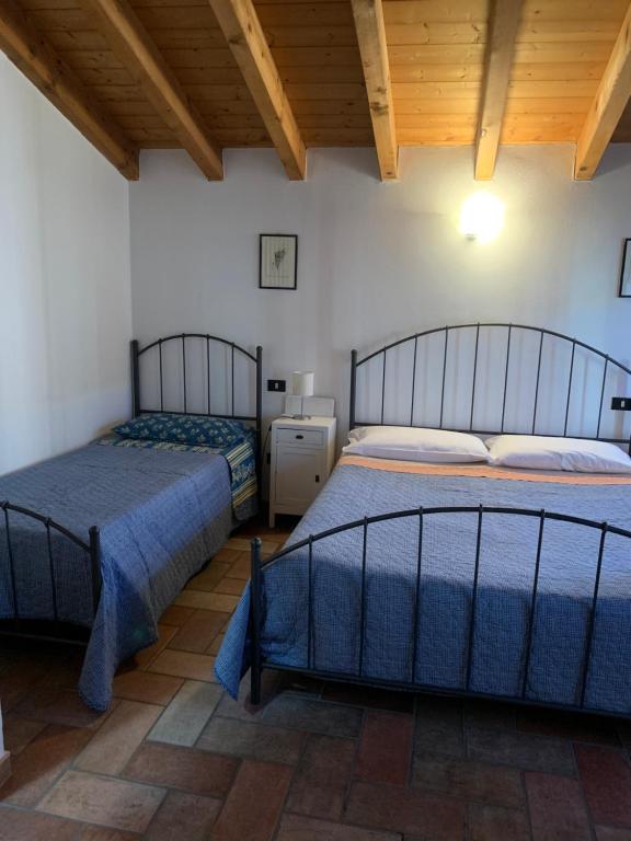Postel nebo postele na pokoji v ubytování Agriturismo Case in Collina