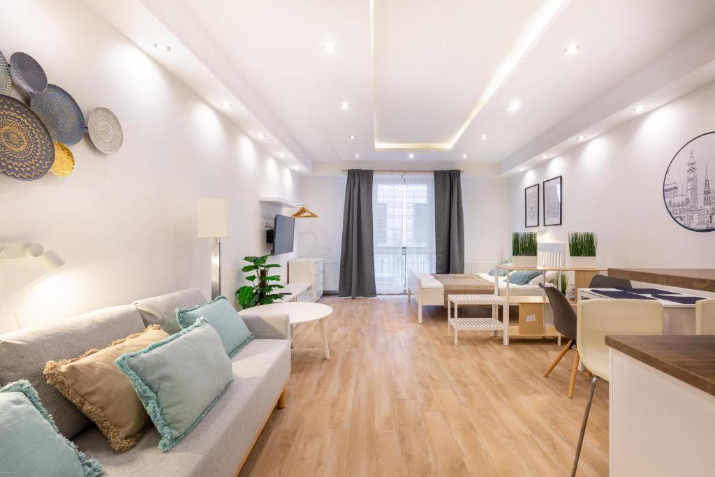 a living room with a couch and a table at Downtown Nature Apartment in Budapest