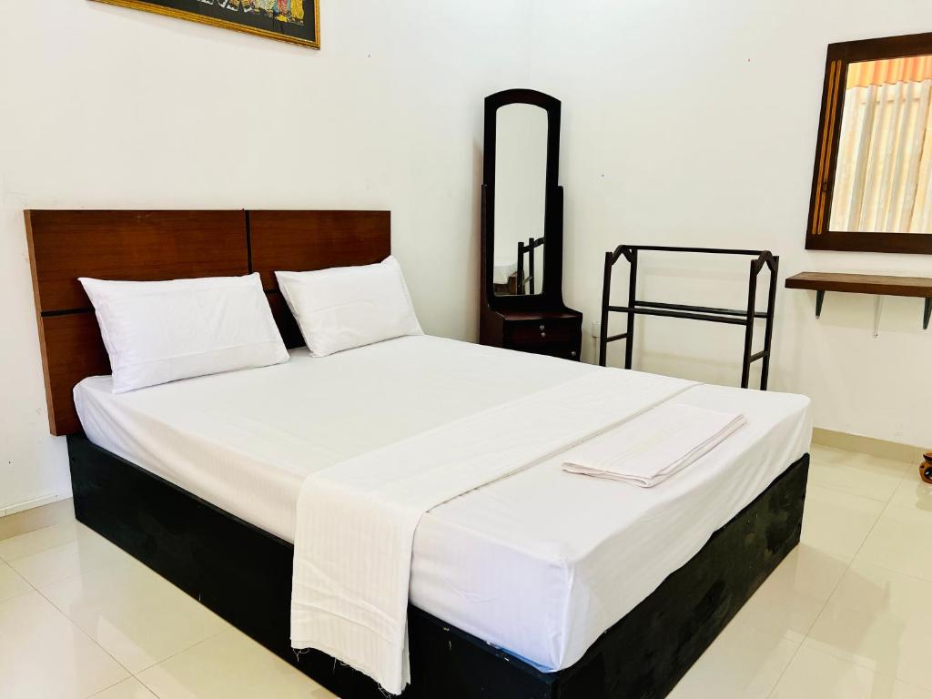 Postel nebo postele na pokoji v ubytování Eco Resort Kandy