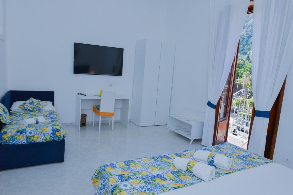 Postel nebo postele na pokoji v ubytování Casa Natalia