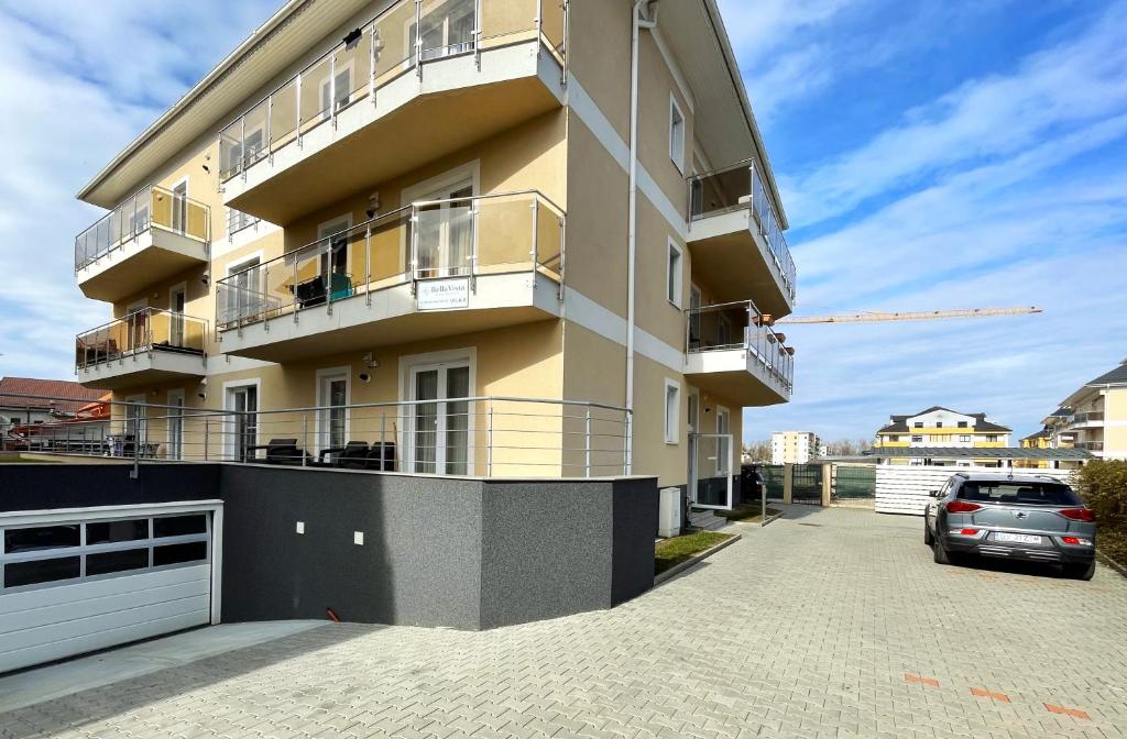 a building with a car parked in front of it at Bella Vista Studio with Balcony in Braşov