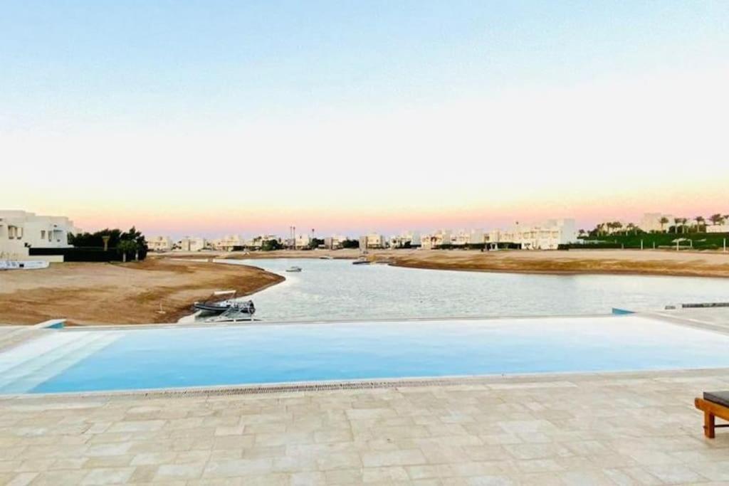 a swimming pool with a view of a river at 1-Bedroom Apartment in Joubal with nice Pool in Hurghada