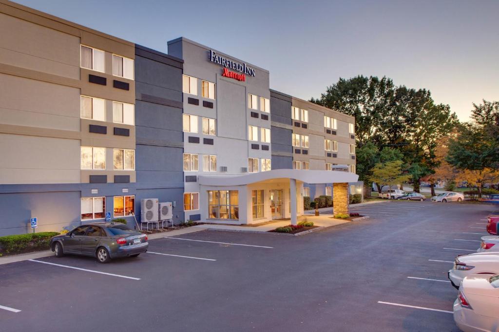 a hotel with a car parked in a parking lot at Fairfield Inn by Marriott Amesbury in Amesbury