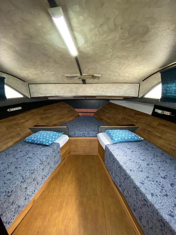 A bed or beds in a room at Experiencia en el mar Gijon C