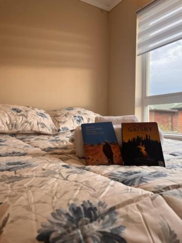 Postel nebo postele na pokoji v ubytování Hostal Damatierra