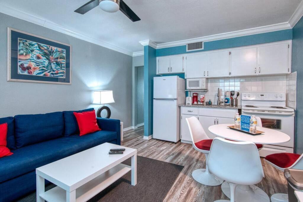 A seating area at Sunset Beach Suites at Madeira Beach! Pet Friendly with Summer Breezes! - Suite 6