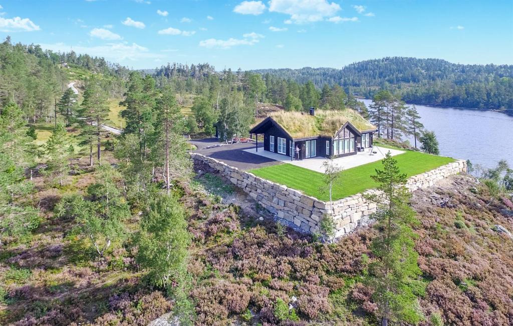 an aerial view of a house with a grass roof at Gorgeous Home In Evje With Lake View in Evje