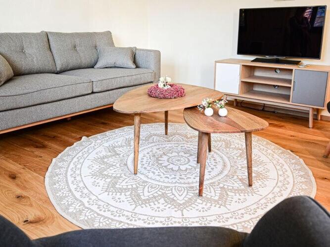 a living room with a couch and a coffee table at Holiday home time out in the monument in Lohr am Main