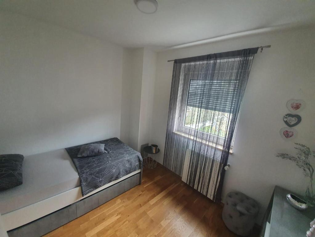 Postel nebo postele na pokoji v ubytování Holiday Home Nikol