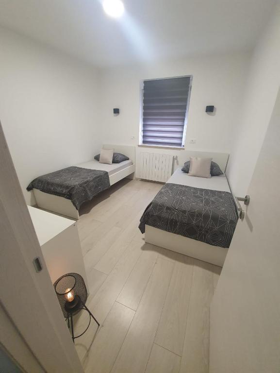 Postel nebo postele na pokoji v ubytování Holiday Home Nikol