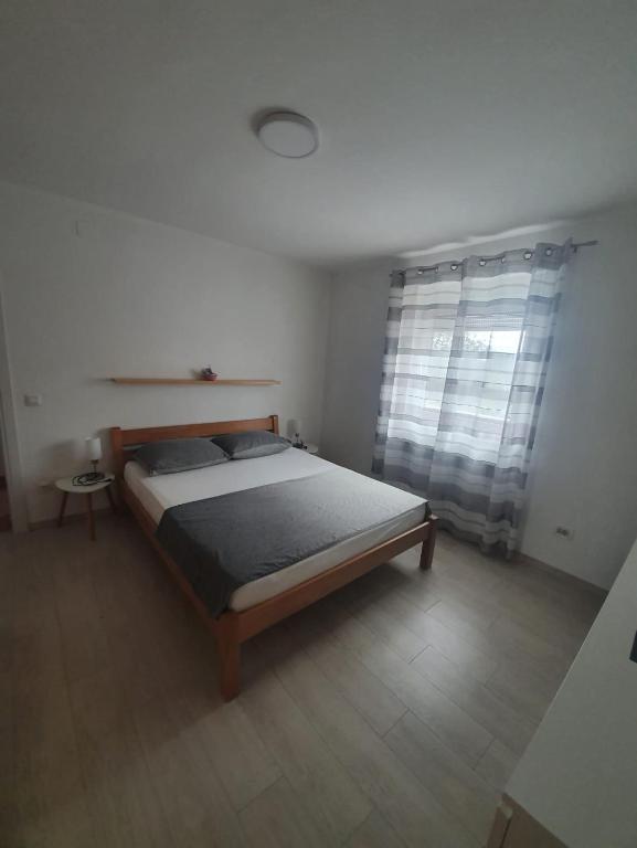 Postel nebo postele na pokoji v ubytování Holiday Home Nikol