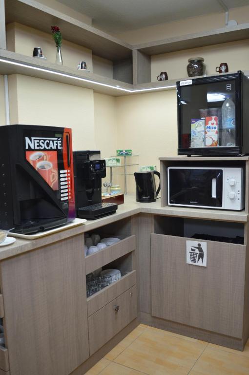 Kuchyň nebo kuchyňský kout v ubytování Alfréd Panzió