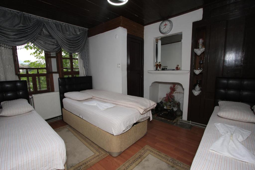 Postel nebo postele na pokoji v ubytování Efe Guest House