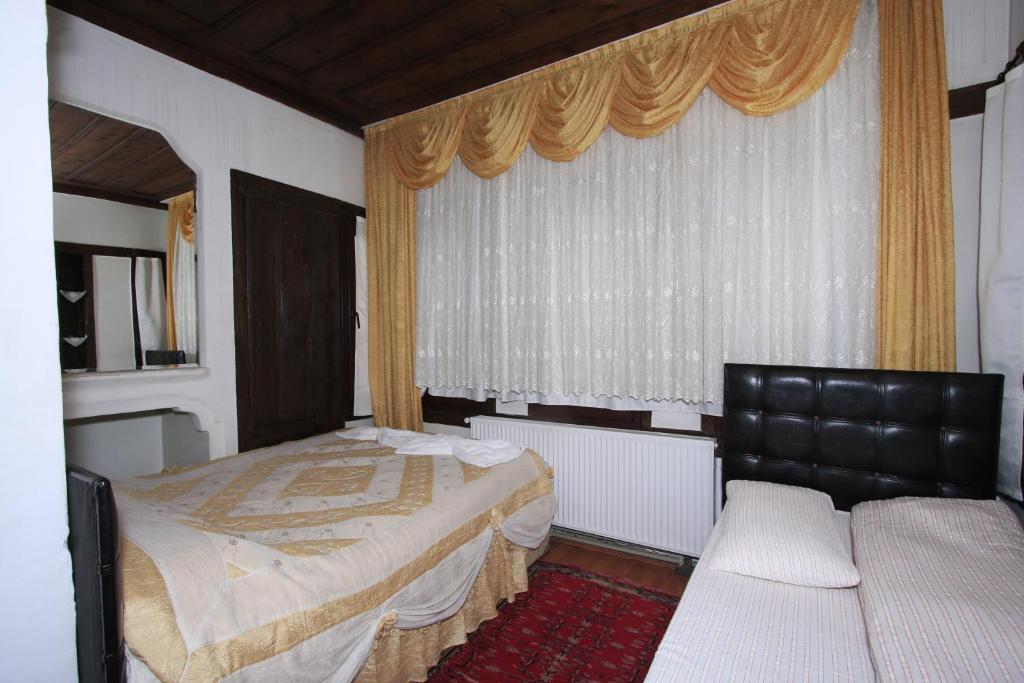 Postel nebo postele na pokoji v ubytování Efe Guest House