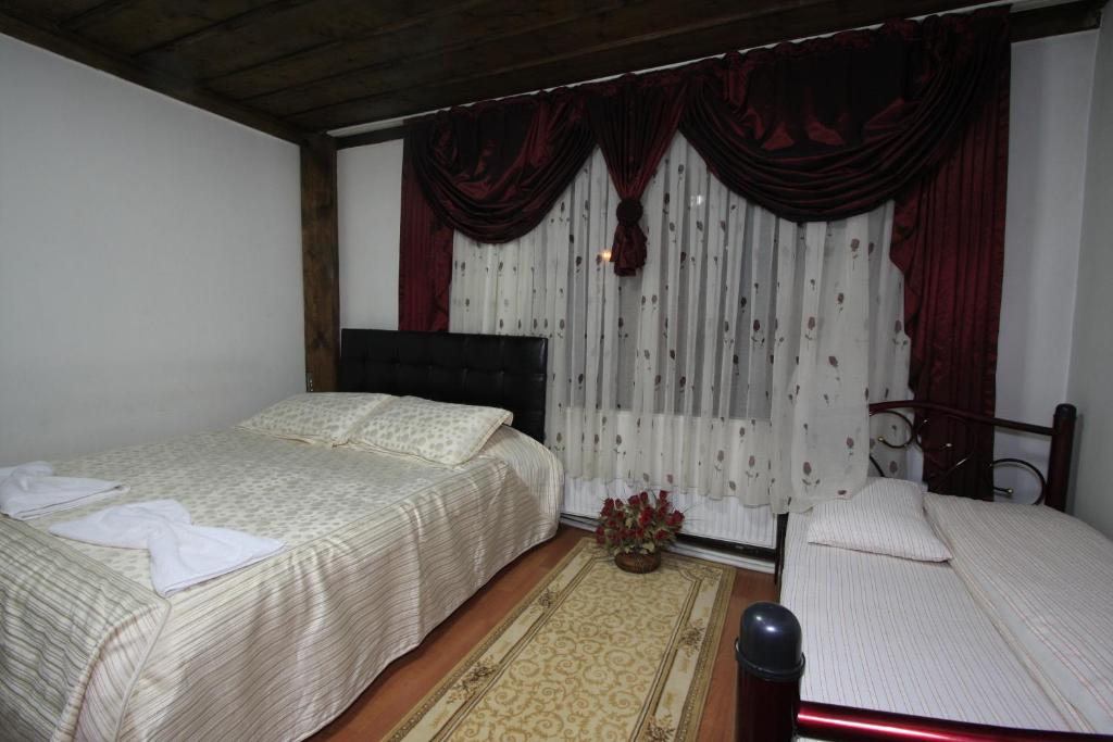 Postel nebo postele na pokoji v ubytování Efe Guest House