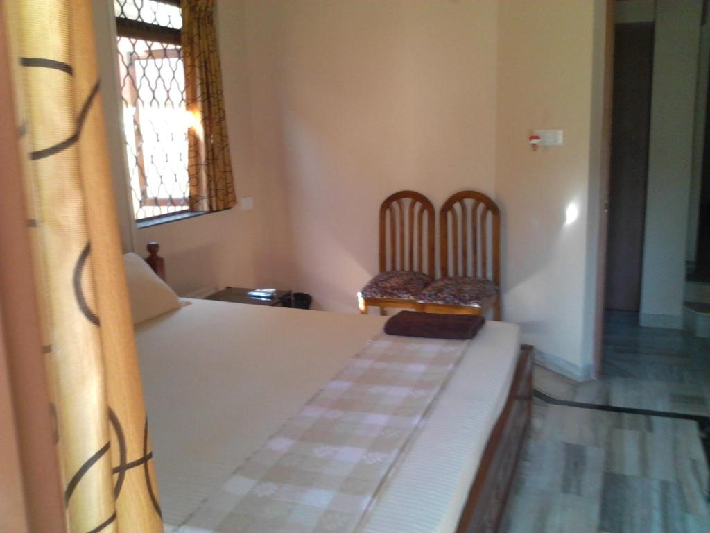 Postel nebo postele na pokoji v ubytování Menezes House