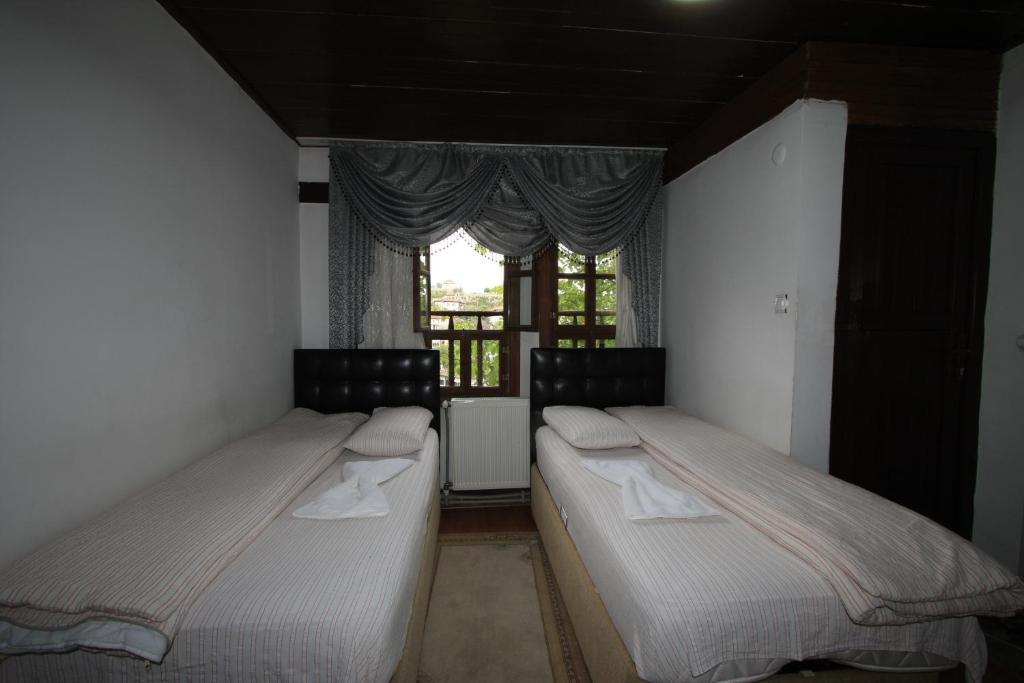 Postel nebo postele na pokoji v ubytování Efe Guest House