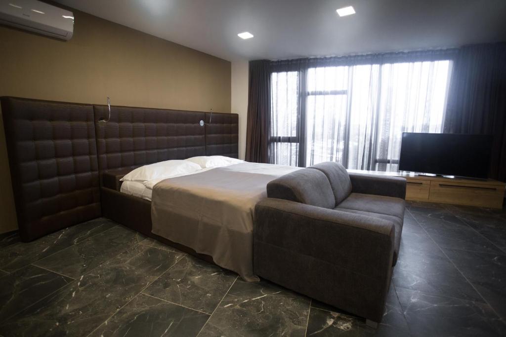 Postel nebo postele na pokoji v ubytování 4 SMART HOTEL
