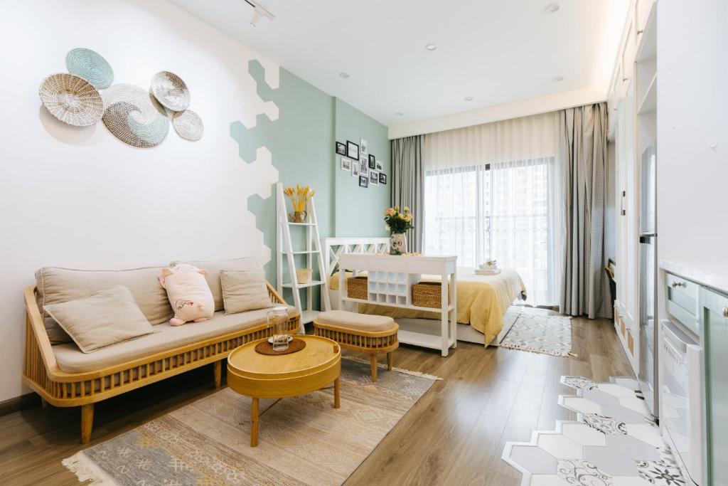 a living room with a couch and a crib at Pearland -D'Eldorado Apartment in Hanoi