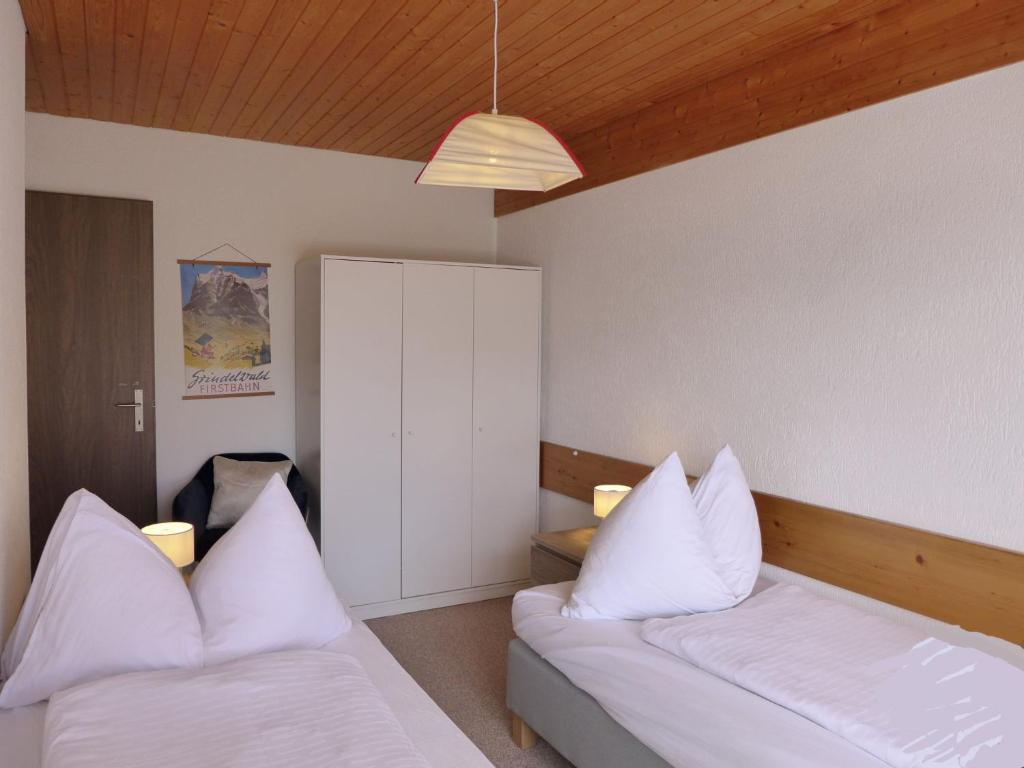 Postel nebo postele na pokoji v ubytování Holiday Home Salzhubelweg by Interhome
