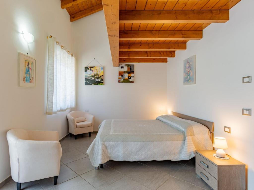 Łóżko lub łóżka w pokoju w obiekcie Holiday Home Carmen by Interhome