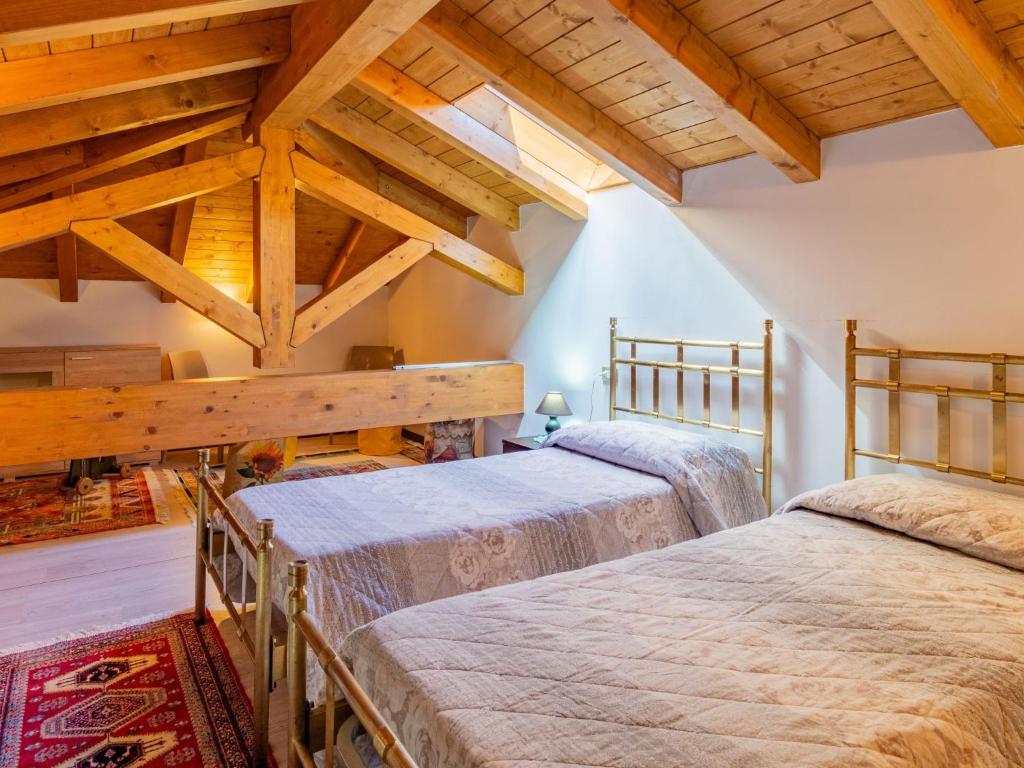 Łóżko lub łóżka w pokoju w obiekcie Holiday Home Carmen by Interhome