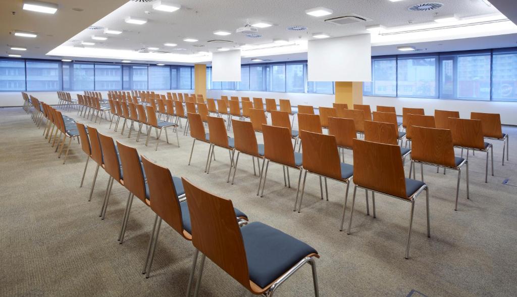a conference room with a long table and chairs at Clarion Congress Hotel České Budějovice in České Budějovice