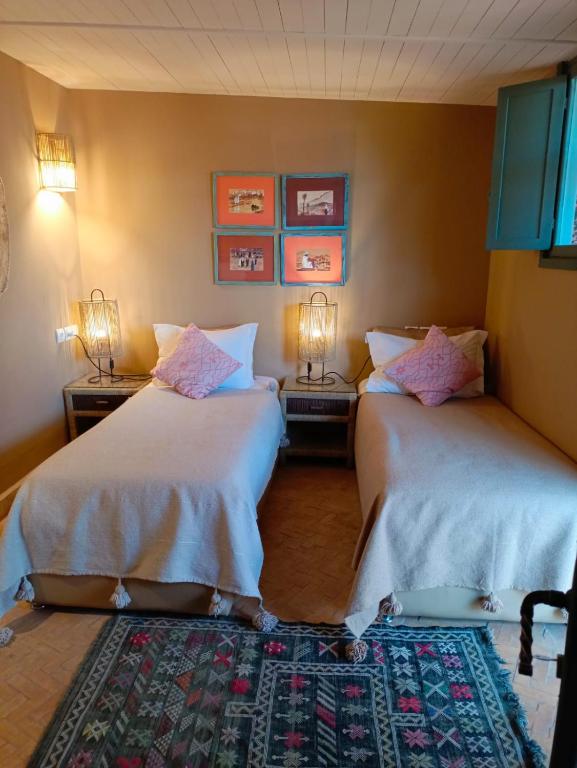 Letto o letti in una camera di Riad Tafilag
