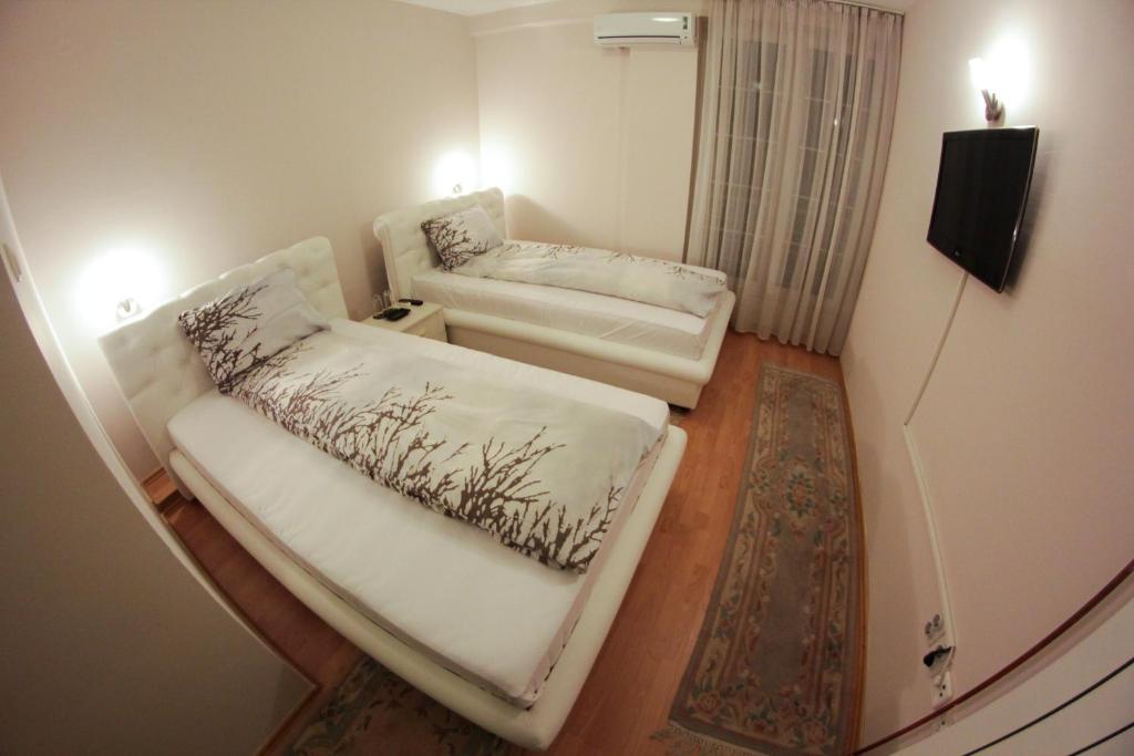 Postel nebo postele na pokoji v ubytování Hotel Fontana
