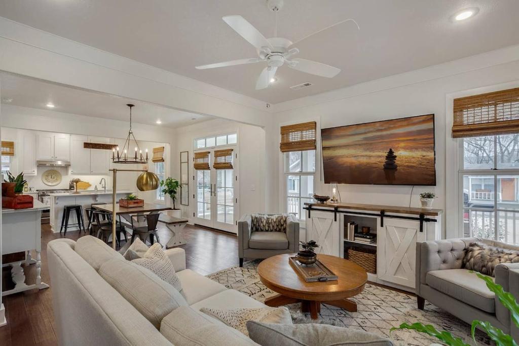 a living room with a couch and a table at The SoFay Farmhouse- 1 MI From U of A in Fayetteville