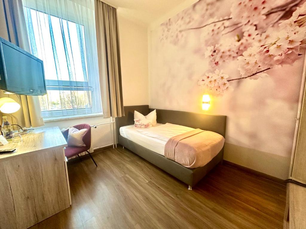 Postel nebo postele na pokoji v ubytování Hotel "Central" Inh Carolin Krause